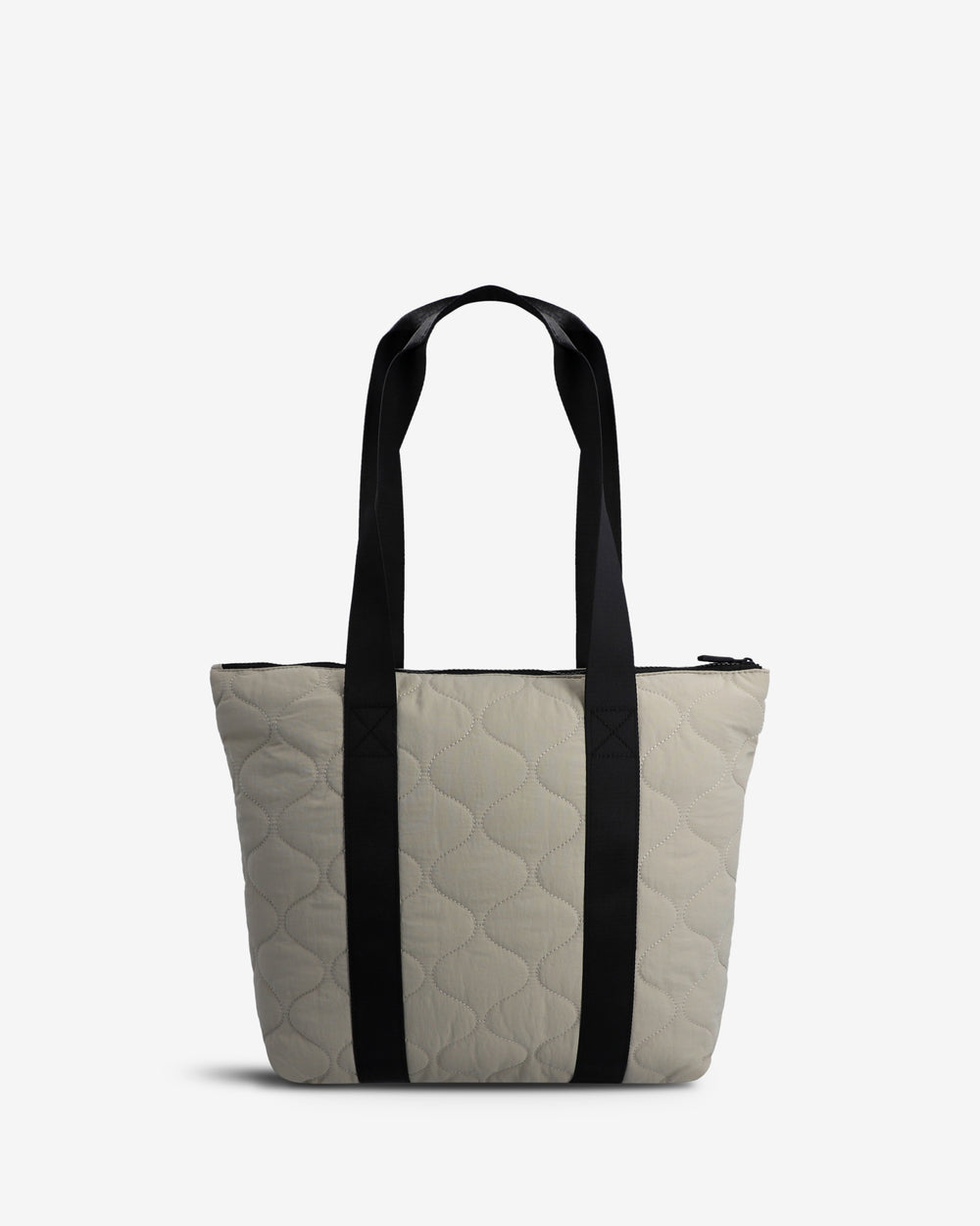 A light beige quilted tote bag with black shoulder straps, shown against a plain white background.