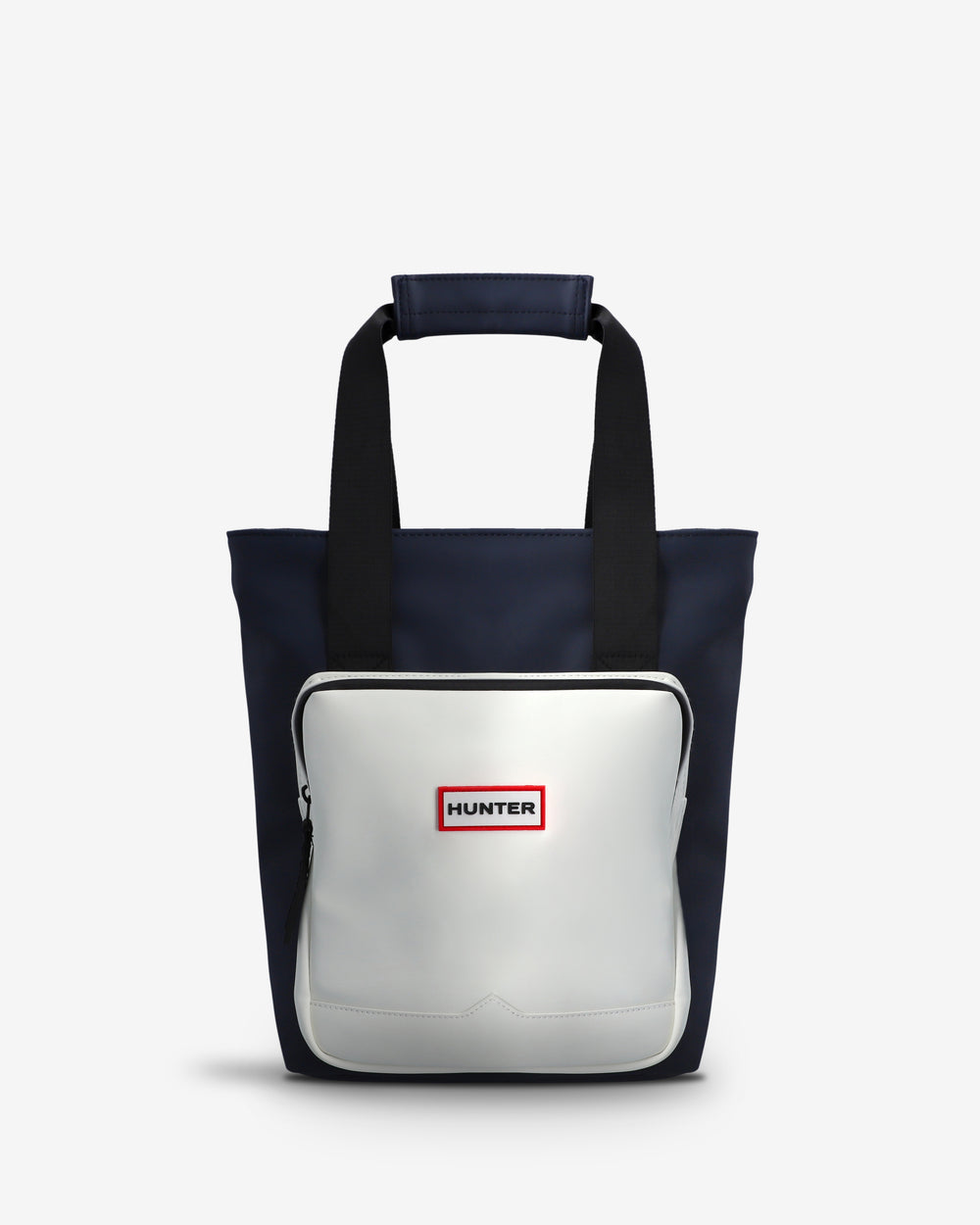 A Hunter tote bag featuring a navy blue body, black handles, and a large white front pocket with a red and white Hunter logo.
