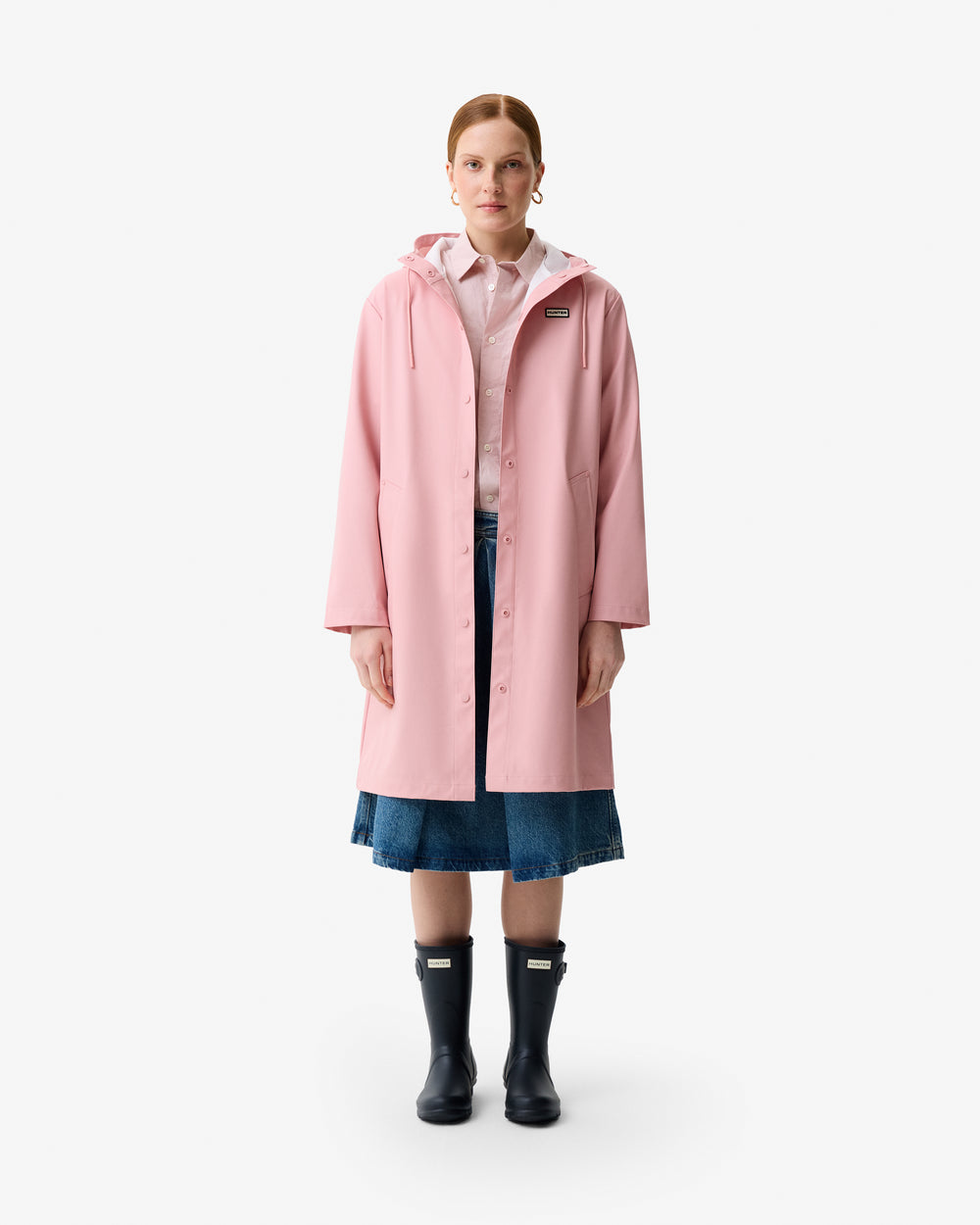 Displays a model wearing the Pink 'Hunter' branded Women's Ellis Pu Raincoat