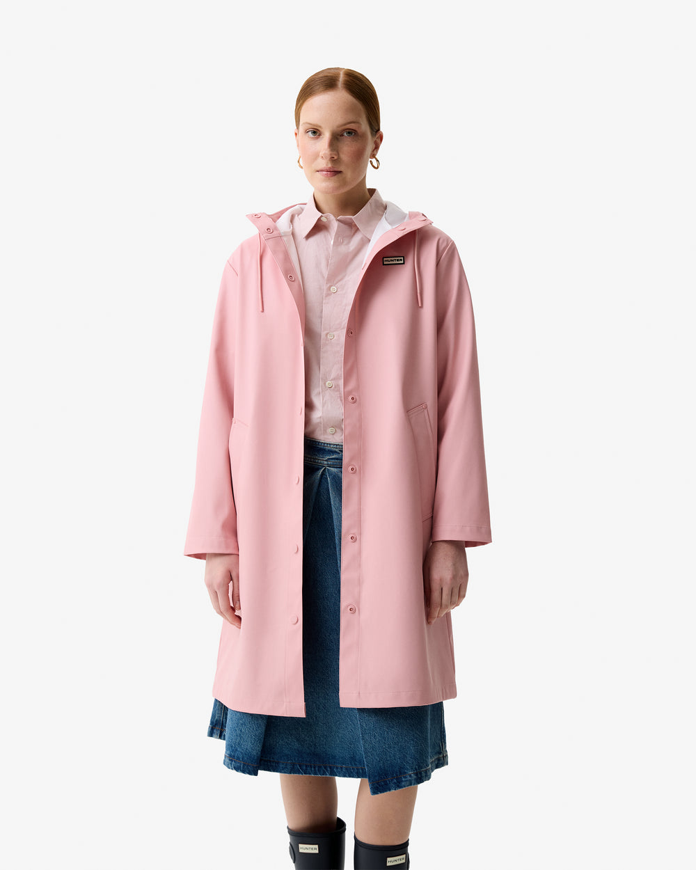 Displays a model wearing the Pink 'Hunter' branded Women's Ellis Pu Raincoat