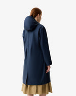 Displays a model wearing the Total Eclipse 'Hunter' branded Women's  Ellis PU Raincoat