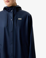 Displays a model wearing the Total Eclipse 'Hunter' branded Women's  Ellis PU Raincoat