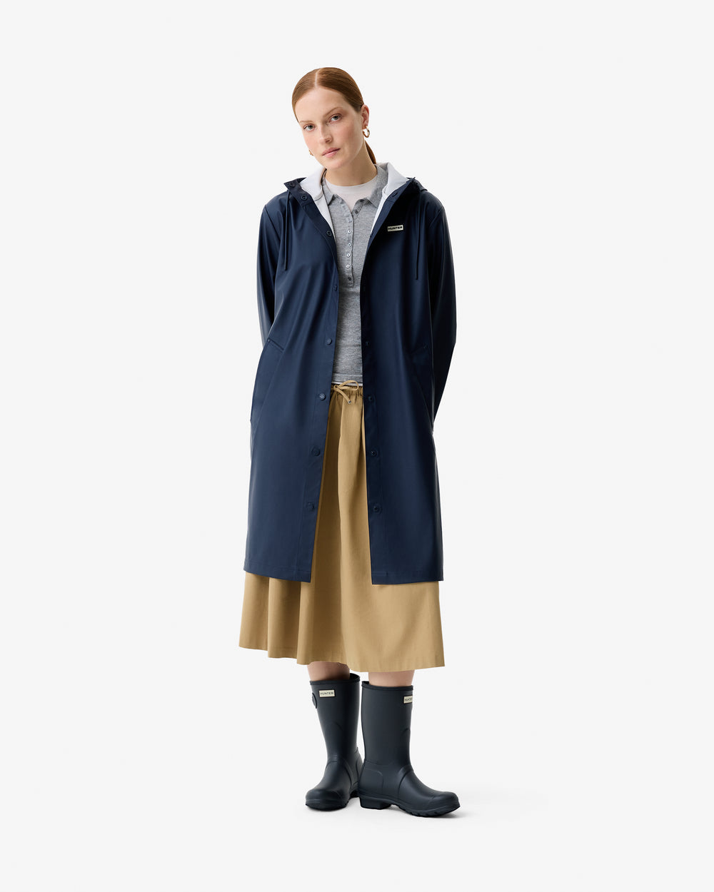 Displays a model wearing the Total Eclipse 'Hunter' branded Women's  Ellis PU Raincoat