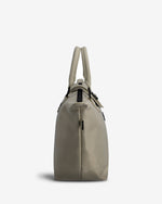Beige crossbody bag on a white background