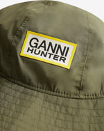 Displays the Green 'Hunter' branded unisex Green GANNI X Hunter Waterproof Bucket Hat featuring the Ganni x Hunter logo