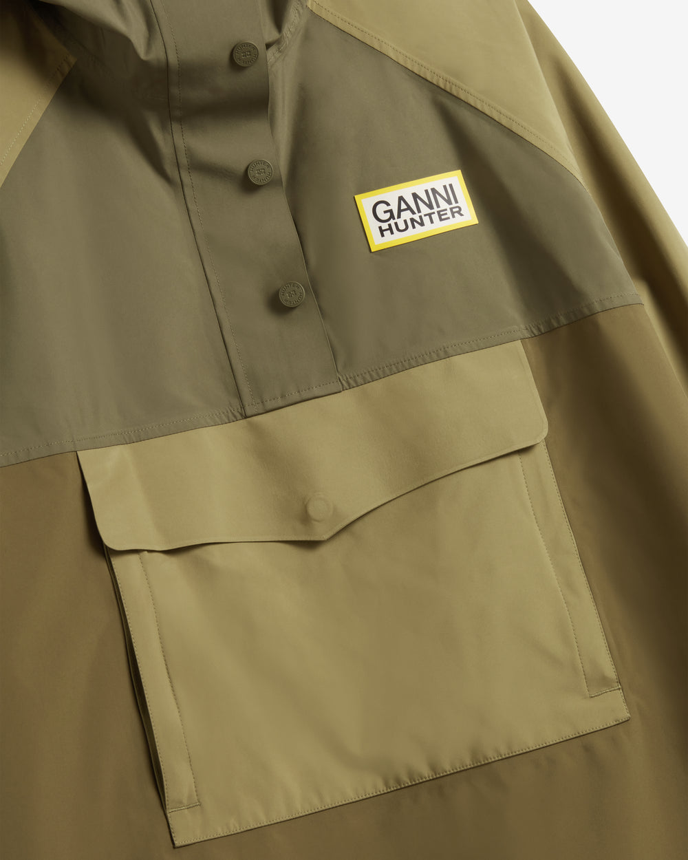 Displays the Green 'Hunter' branded Unisex GANNI X Hunter Waterproof Poncho
