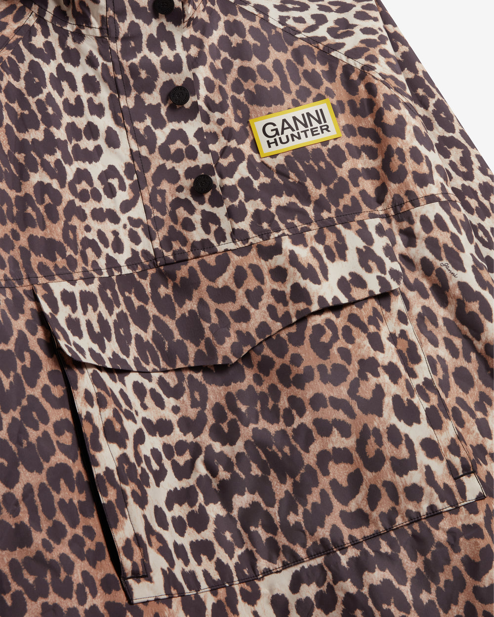 Displays the Leopard 'Hunter' branded unisex GANNI X Hunter Waterproof Poncho featuring the Ganni x Hunter logo branding 
