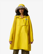 Displays a model wearing the Lemon 'Hunter' branded Unisex Ganni X Hunter Waterproof Poncho