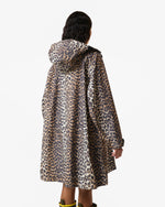 Displays a model wearing the Leopard 'Hunter' branded unisex GANNI X Hunter Waterproof Poncho