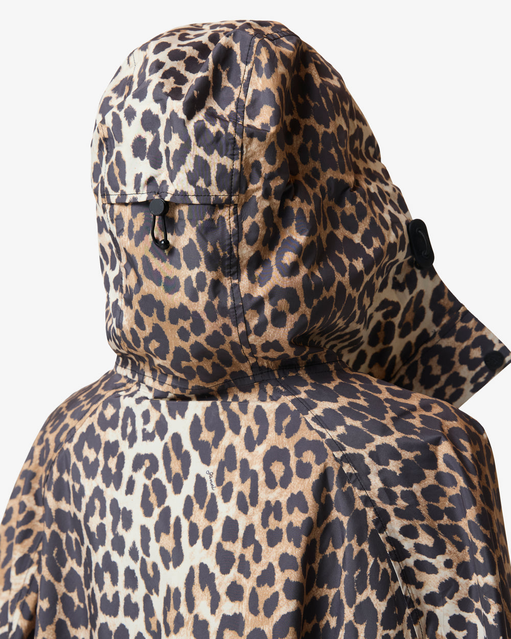 Displays a model wearing the Leopard 'Hunter' branded unisex GANNI X Hunter Waterproof Poncho