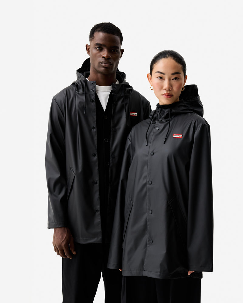 Displays two models wearing Black 'Hunter' branded Unisex Downpour Jo PU Rain Parka