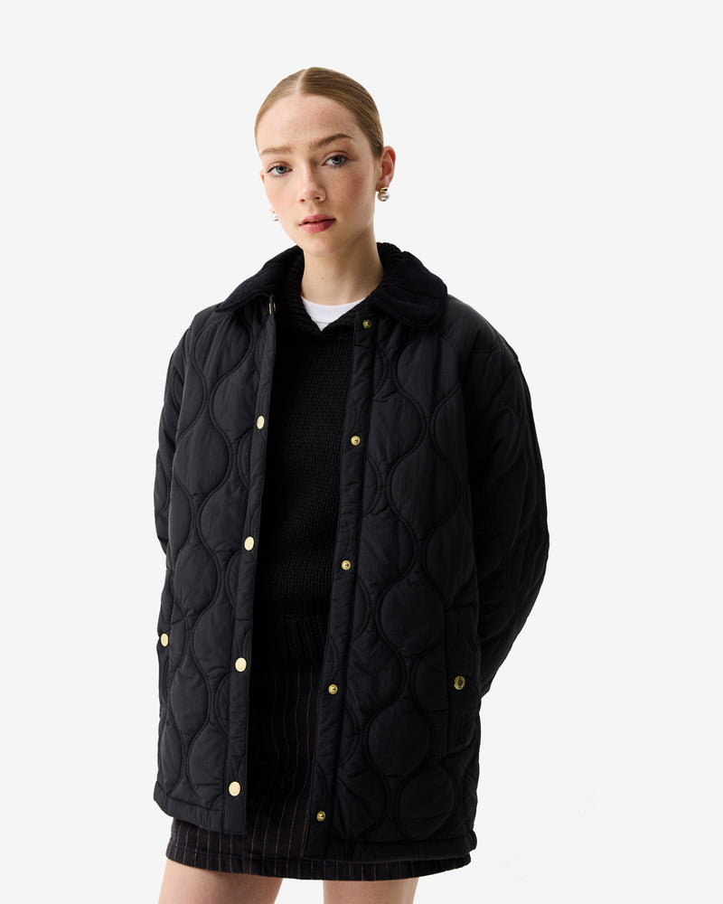 Displays a model wearing the Black 'Hunter' branded Women’s Witton Quilted Shacket