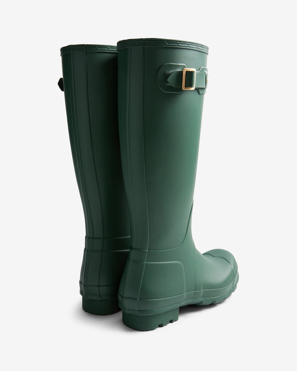 Pair of green rain boots on a white background