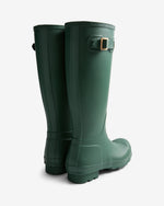 Pair of green rain boots on a white background