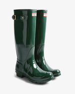 Green Hunter rain boots on a white background