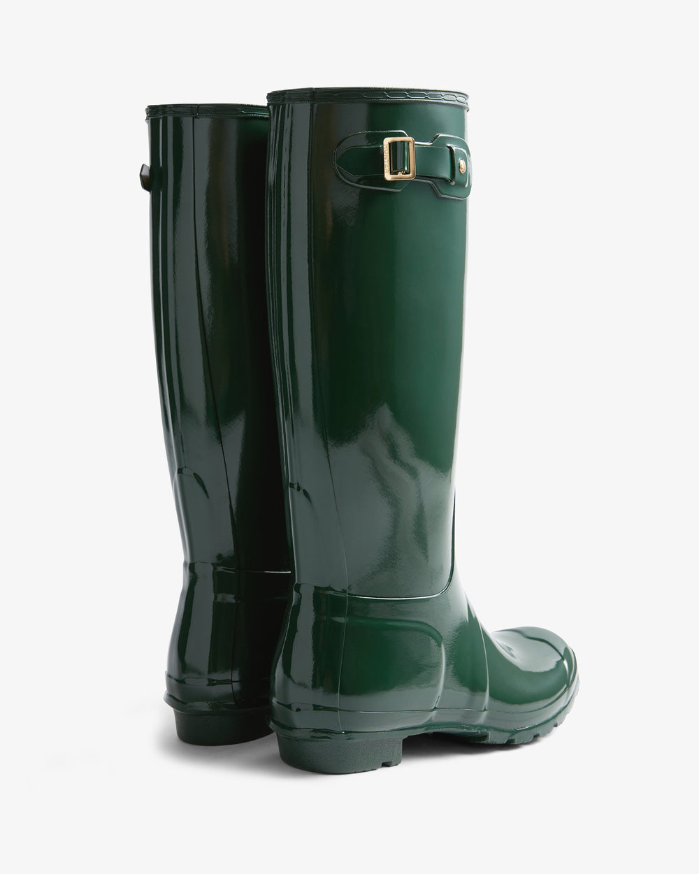 Pair of green rain boots on a white background