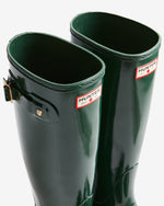 Green Hunter rain boots on a white background