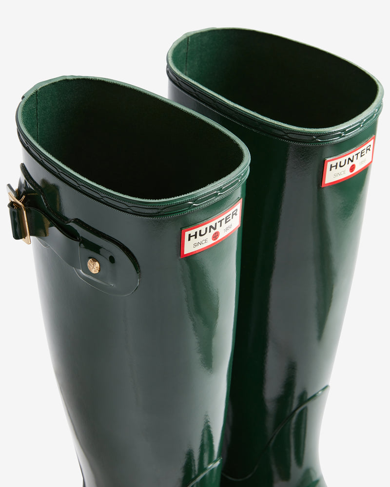 Green Hunter rain boots on a white background