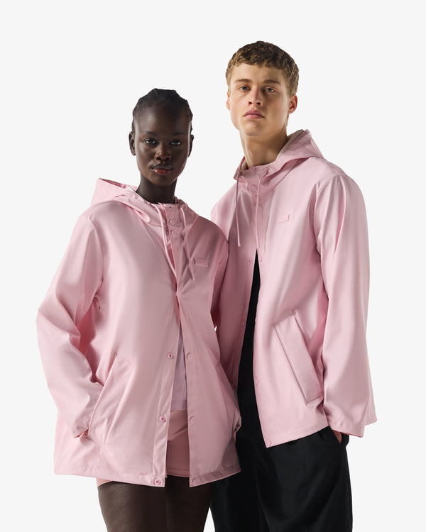 Displays two models wearing the Parfait Pink 'Hunter' branded Unisex Downpour Izzy PU Hooded Jacket