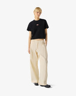 Displays a model wearing Black 'Hunter' branded Women's Essentials Logo Boxy Cropped T-Shirt