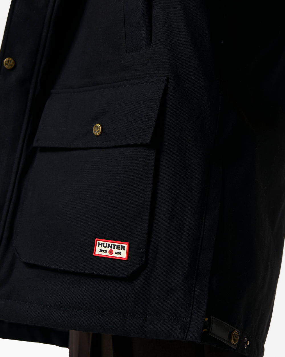 Displays a model wearing the Black 'Hunter' branded Men's Original 170 Yrs Anniversary Jacket featuring the details on the hunter branding 