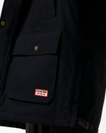 Displays a model wearing the Black 'Hunter' branded Men's Original 170 Yrs Anniversary Jacket featuring the details on the hunter branding 