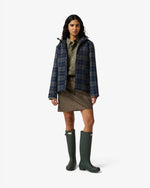 Displays a model wearing the kambaba 'Hunter' branded Women's Original Waterproof Tartan Jacket