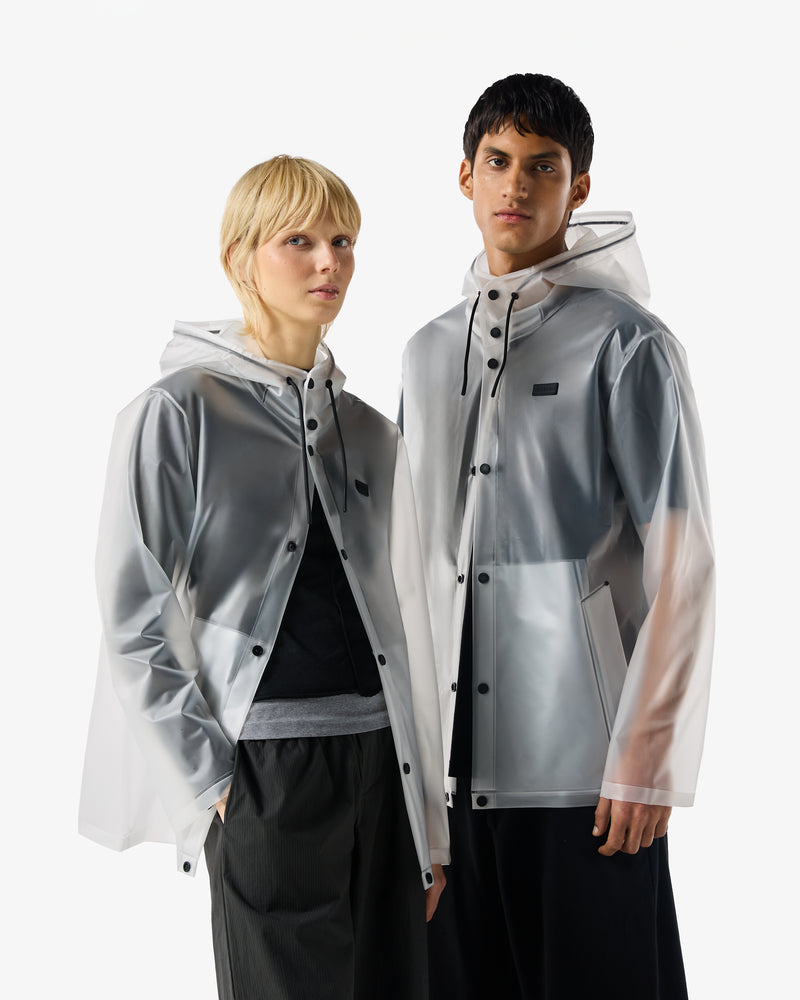 Shows 2 people wearing the Izzy clear matte 'Hunter' branded Unisex Downpour Hooded Jacket