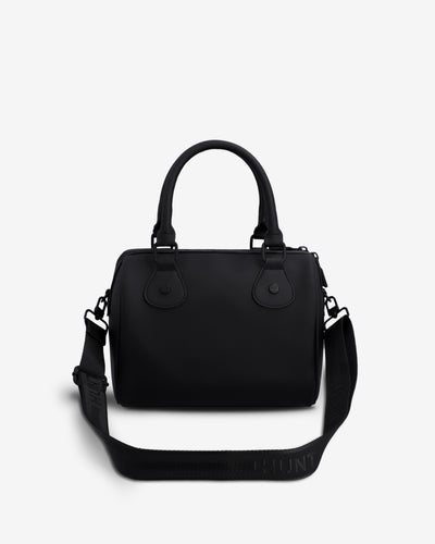 A black leather handbag with top handles and a detachable shoulder strap, photographed against a clean white background.