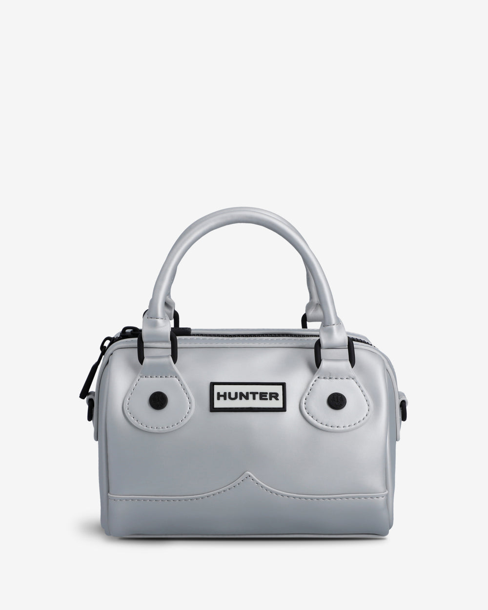 A light gray structured handbag with dual top handles, black hardware, and a central rectangular patch reading HUNTER, shown on a plain light background.