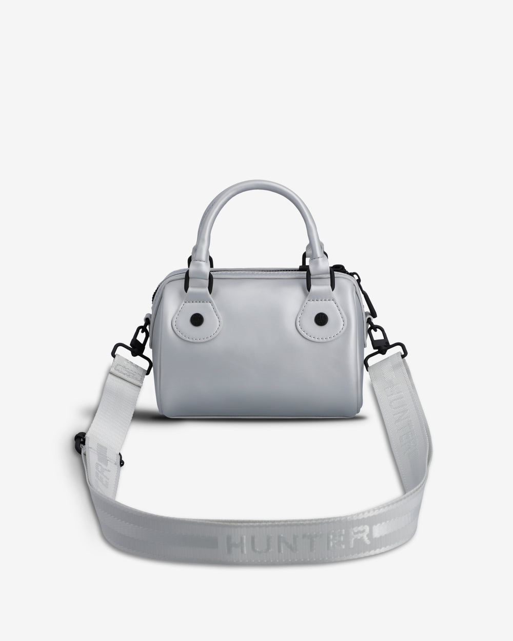 A light gray top-handle handbag with a matching shoulder strap, featuring the HUNTER brand name embossed on the strap, set against a plain light gray background.