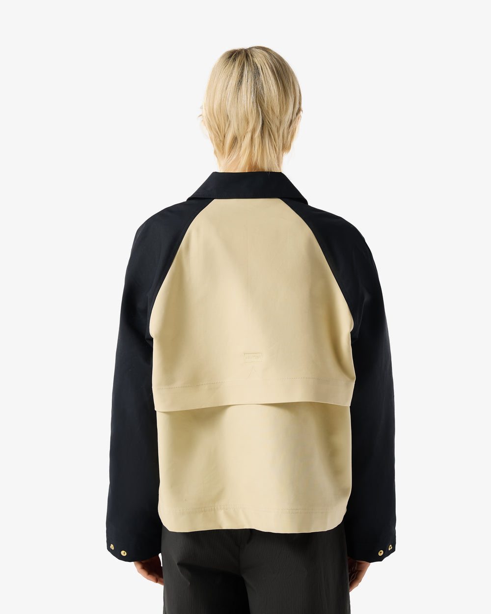 Displays a model wearing the Beige 'Hunter' branded Recrafted Cropped Jacket