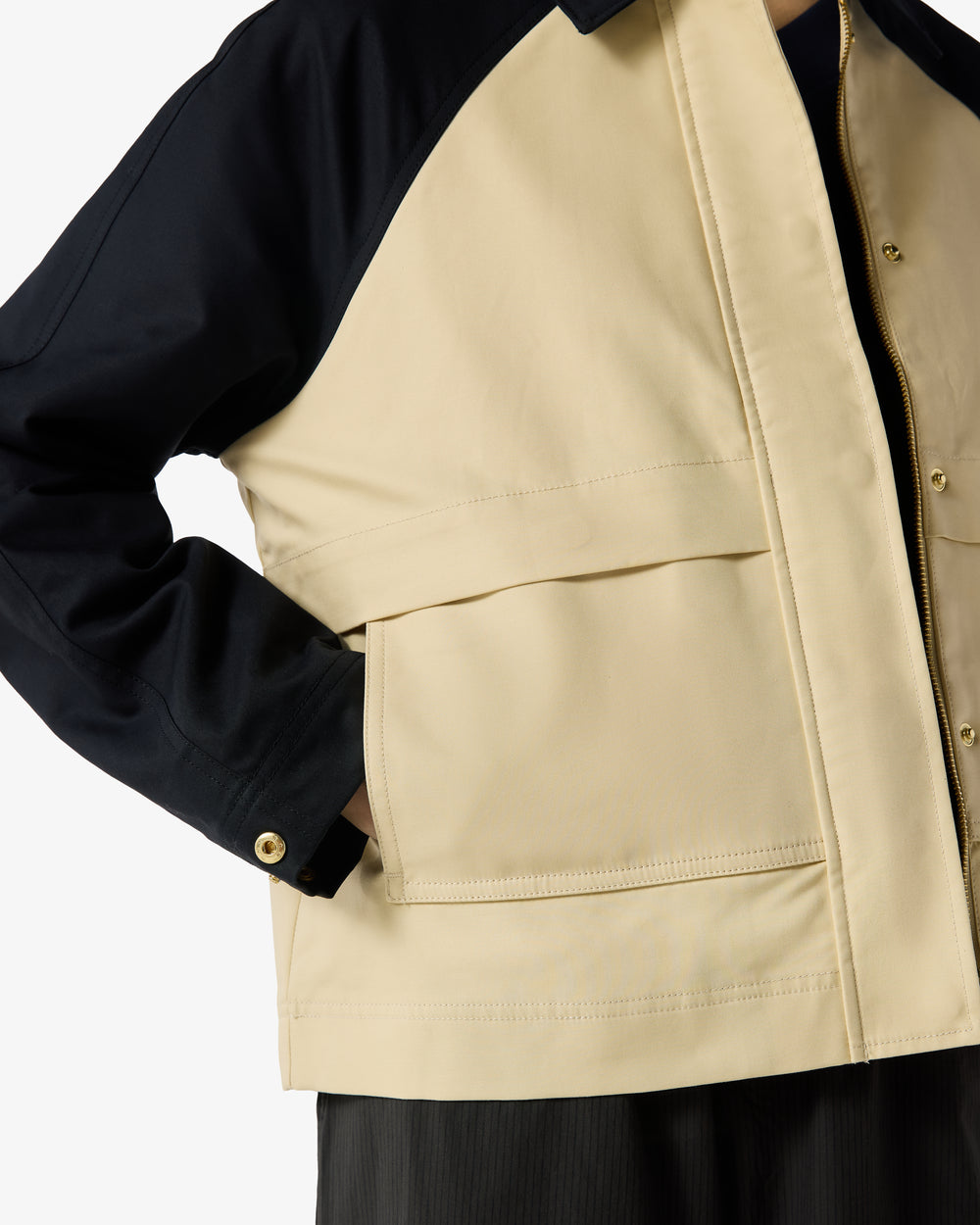 Displays a model wearing the Beige 'Hunter' branded Recrafted Cropped Jacket