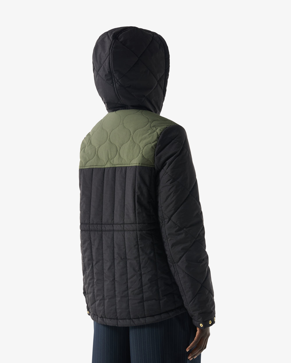 Displays a model wearing the Green 'Hunter' branded Women's Recrafted Quilted Jacket