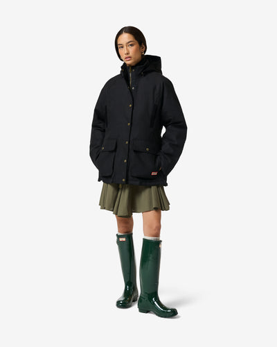 Displays a model wearing the black 'Hunter' branded Women's Original 170 Yrs Anniversary Jacket