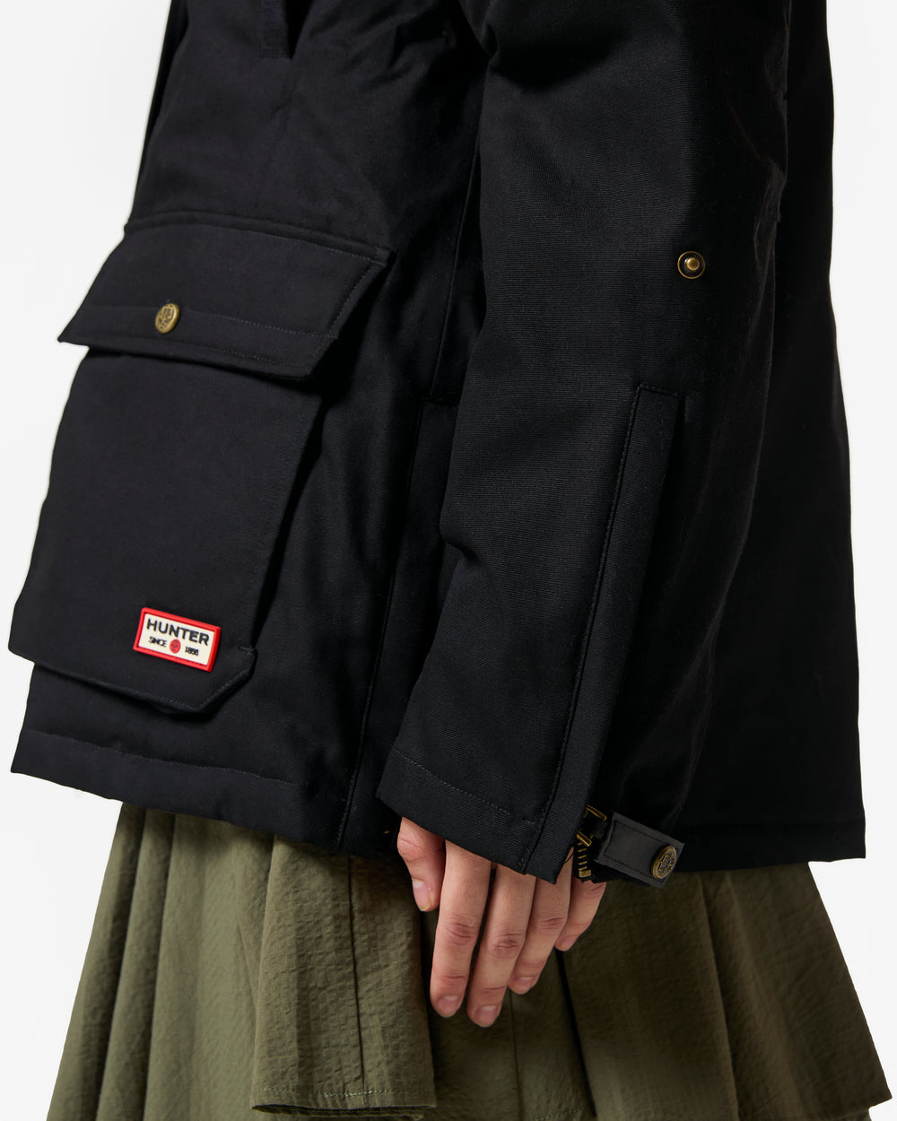 Displays a model wearing the black 'Hunter' branded Women's Original 170 Yrs Anniversary Jacket featuring the details and hunter branding 