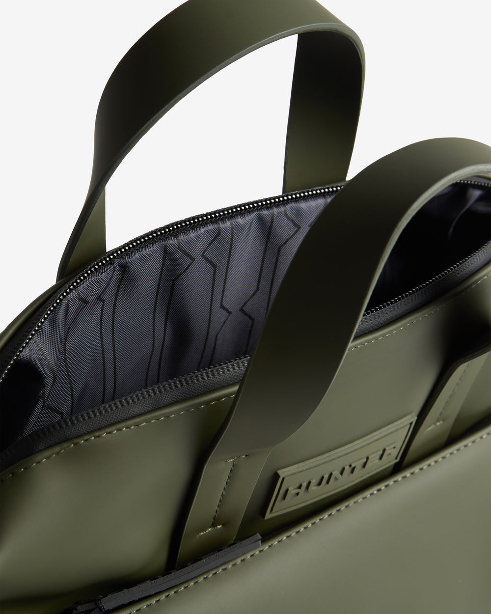 Displays the Green Islay 'Hunter' branded Pu Commuter Backpack