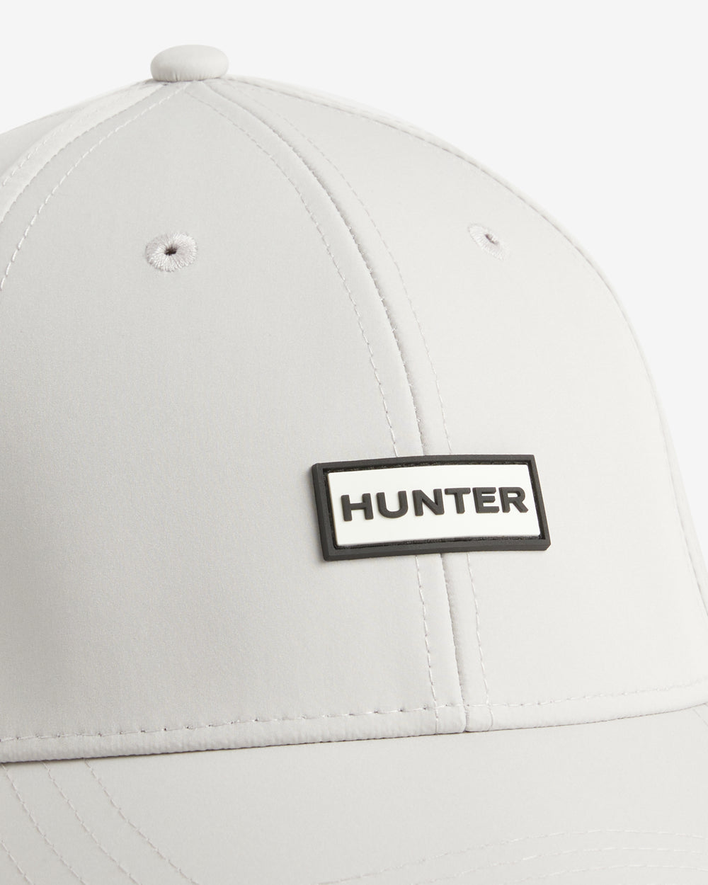 Displays the White 'Hunter' branded Storm Cap