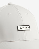 Displays the White 'Hunter' branded Storm Cap